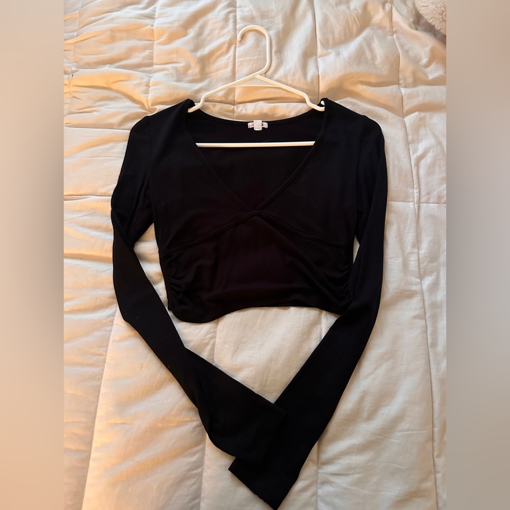 Black long sleeve with little bra detail on front.